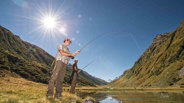 Fishing at the Silvretta-Bielerhöhe in Montafon | © Golm Silvretta Lünersee Tourismus GmbH Bregenz, Patrick Saely Two fishermen fishing at a small pond surrounded by a mountain scenery | © Golm Silvretta Lünersee Tourismus GmbH Bregenz, Patrick Saely
